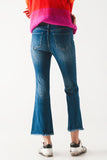 The Q2 Flared Skinny Jeans with Raw Edge - Mid Wash